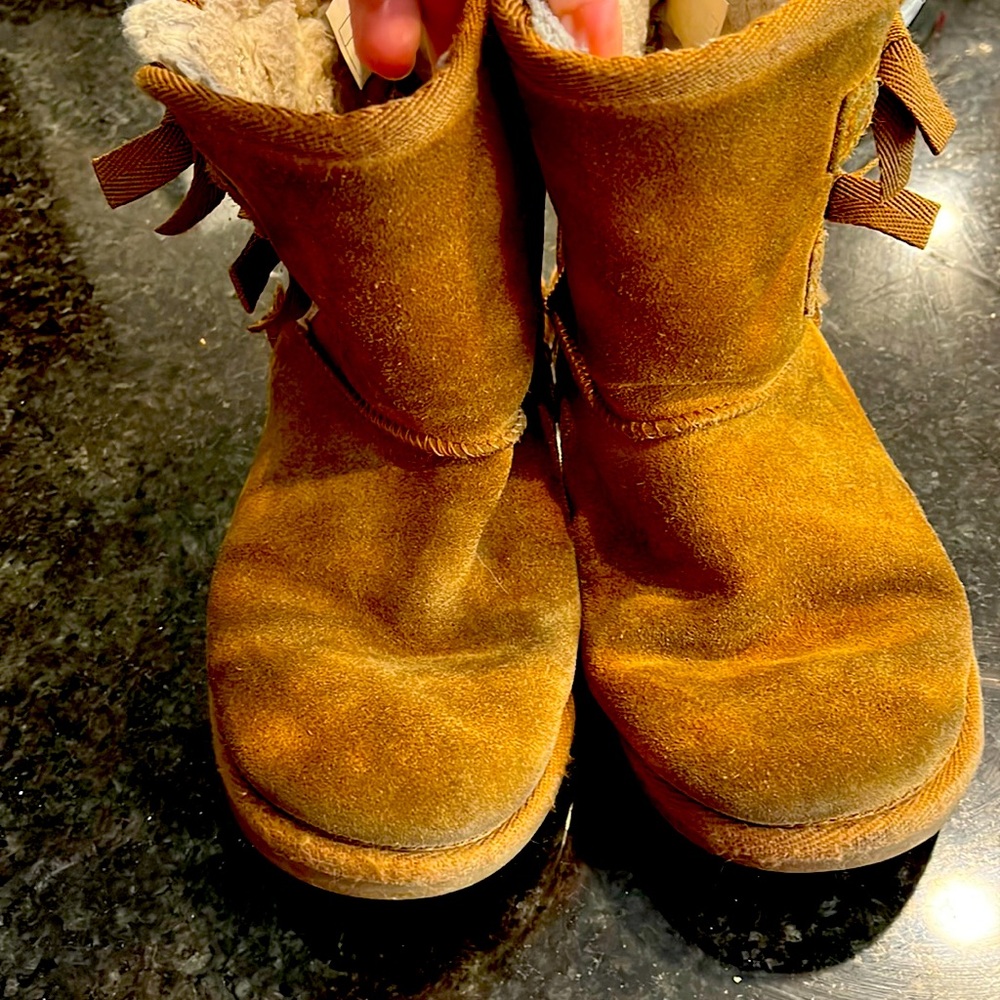 Still lots of life in these and super cute with bows! Light brown Ugg’s boots